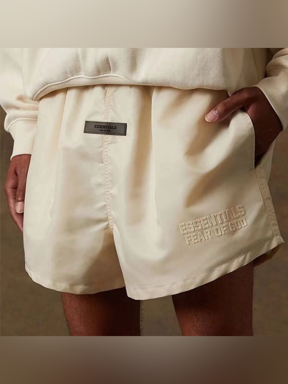 Fear of God Essentials Running Shorts in Eggshell